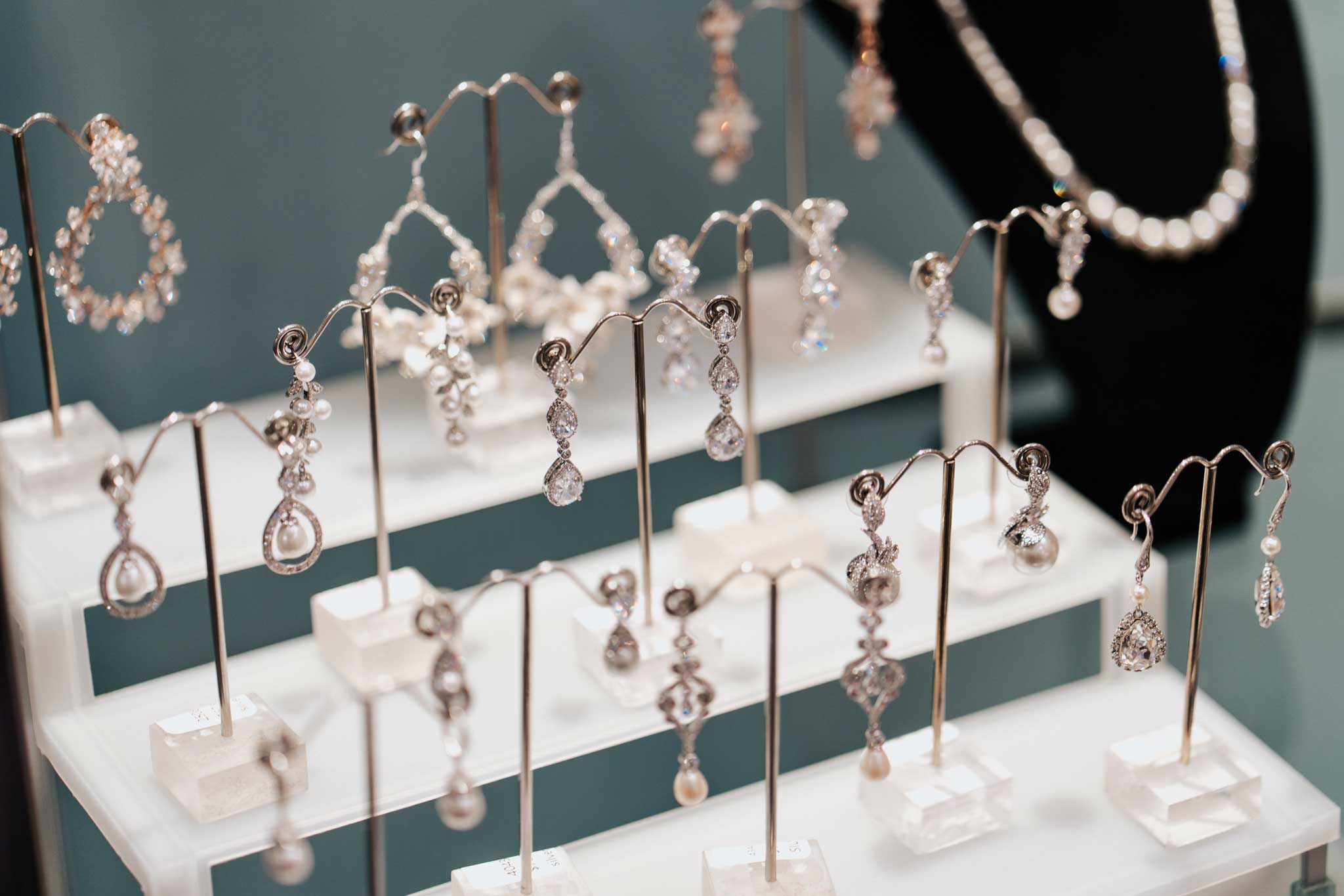 A display of necklaces and earrings in a bridal shop.